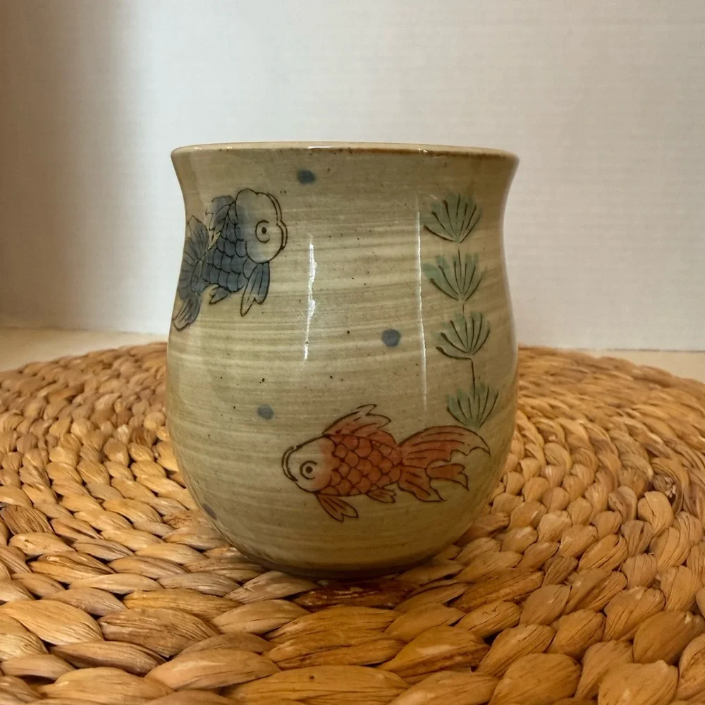 Handcrafted glazed pottery fish cup